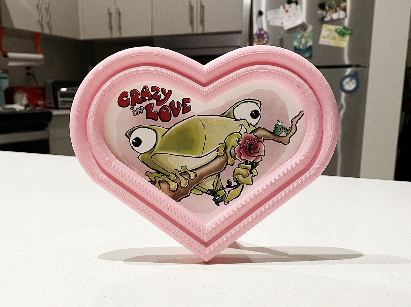 Illustrated Frog in a custom designed, 3D printed frame.