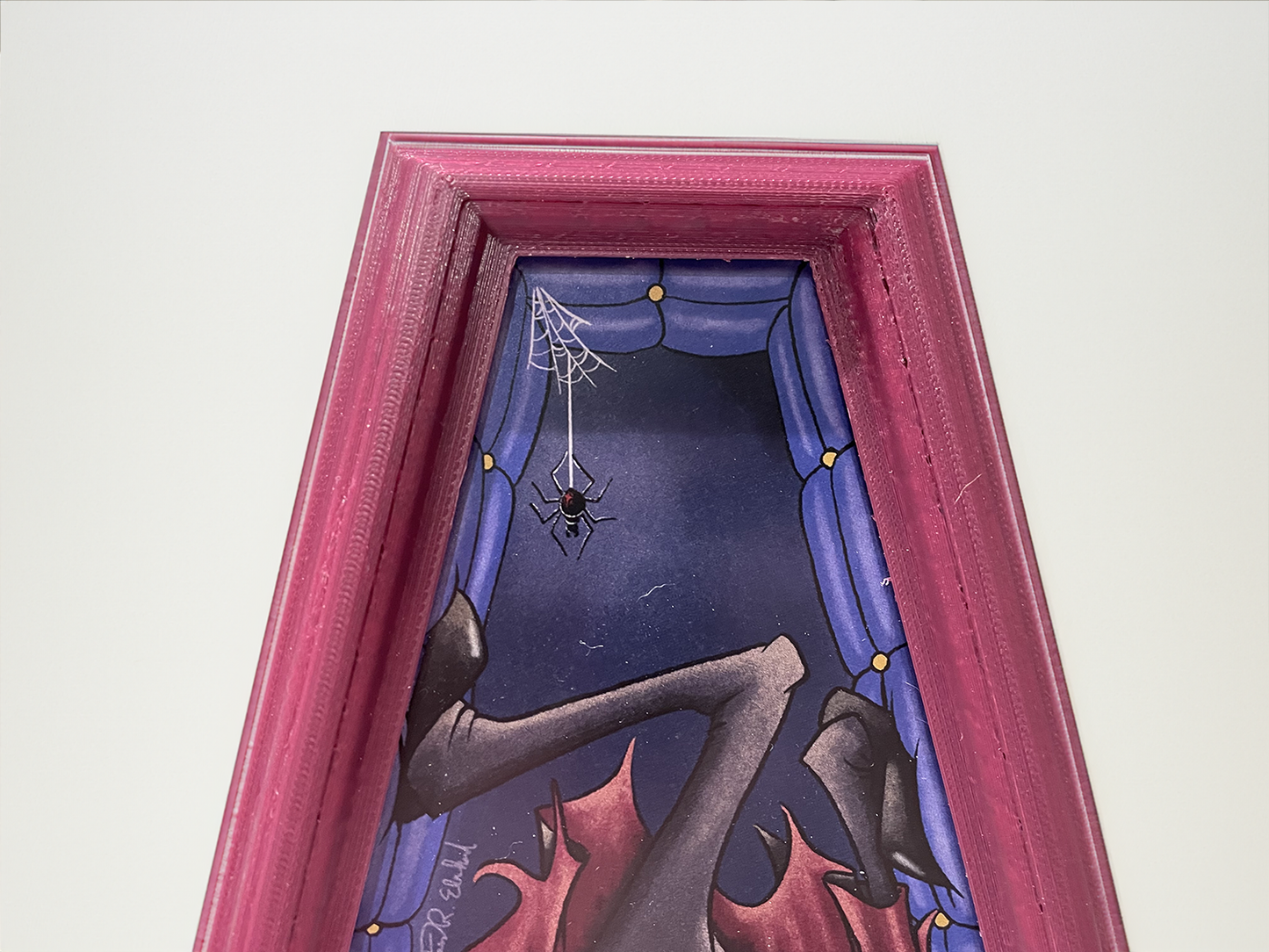 Illustrated Dracula in a custom designed, 3D printed frame.