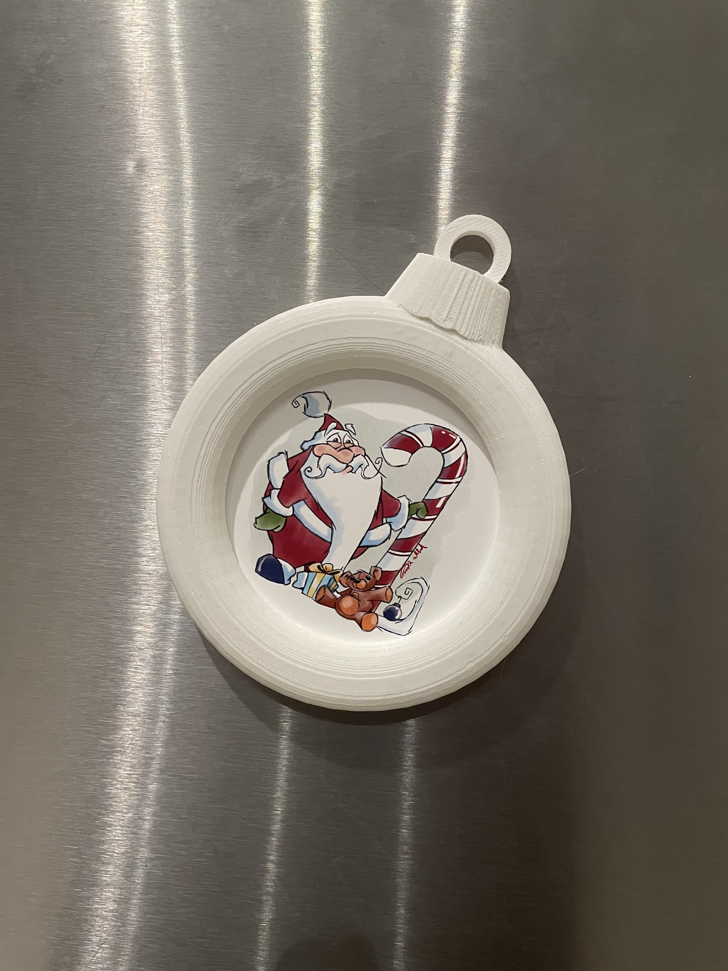 Illustrated Santa Magnet in custom designed 3D printed frame.