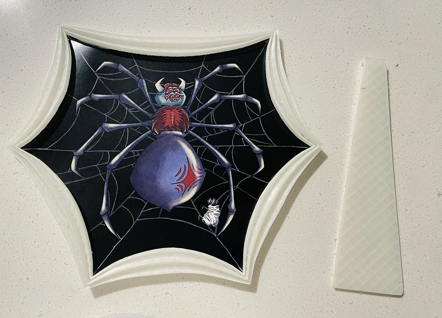 Illustrated Spider in a custom designed, GLOW IN THE DARK, 3D printed frame.